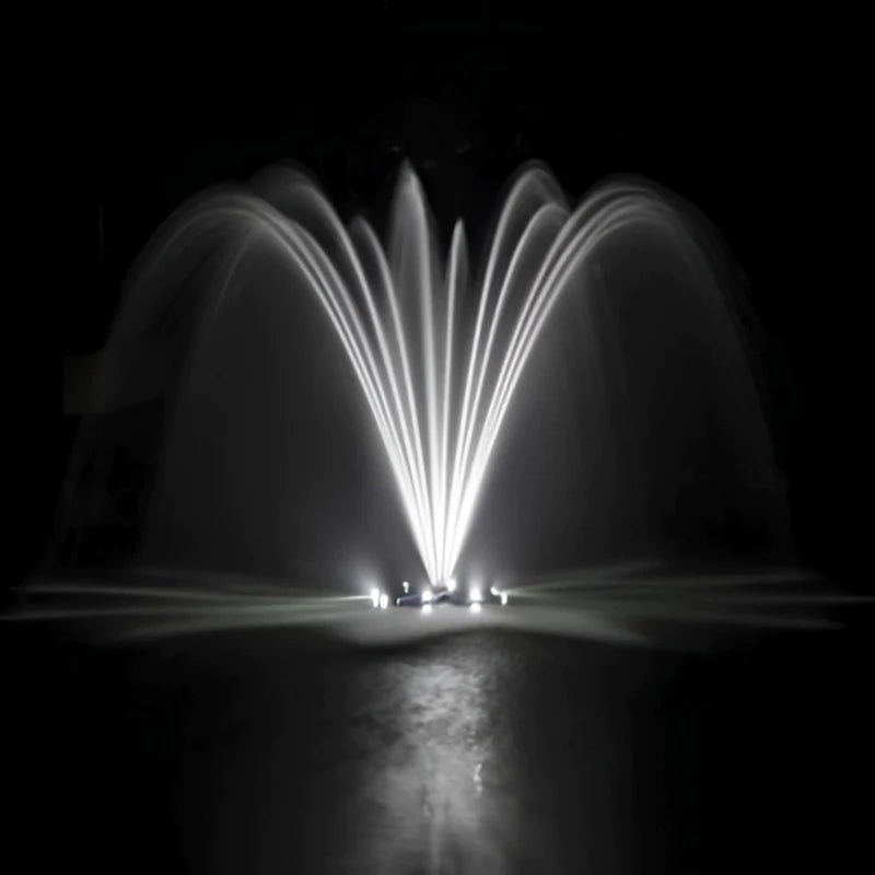 Airmax EcoSeries Single Arch Fountain Nozzle Head Operating in Pond at night with white LED lights | Your Pond Pros