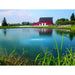 Image of a pond on a farm in front of a red barn with bubbles on the pond surface from an Airmax PS40 4 Acre Pond Aerator | Your Pond Pros