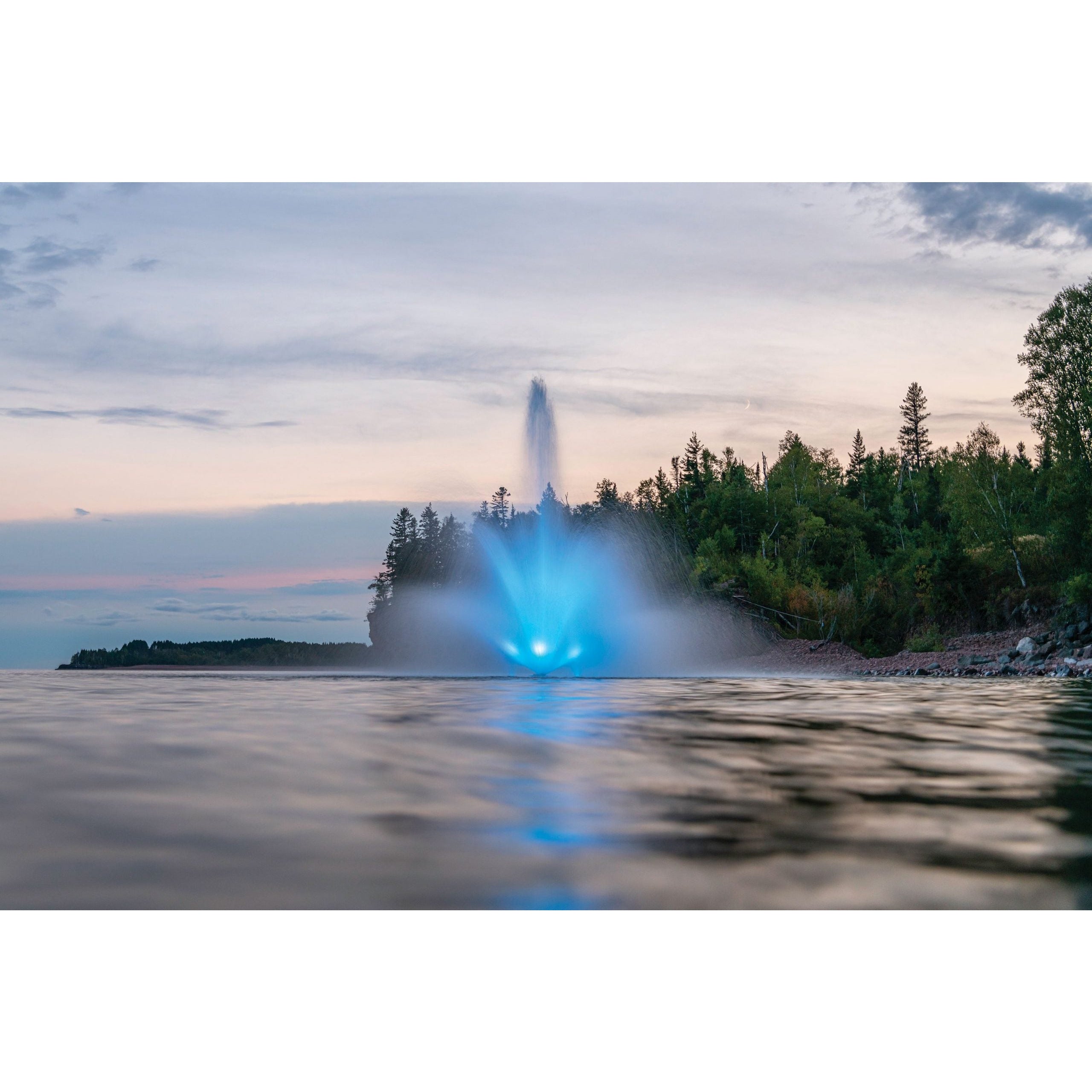 KAsco J Series Fountain operating in pond with blue light from Kasco LED RGB Light Kit | Your Pond Pros